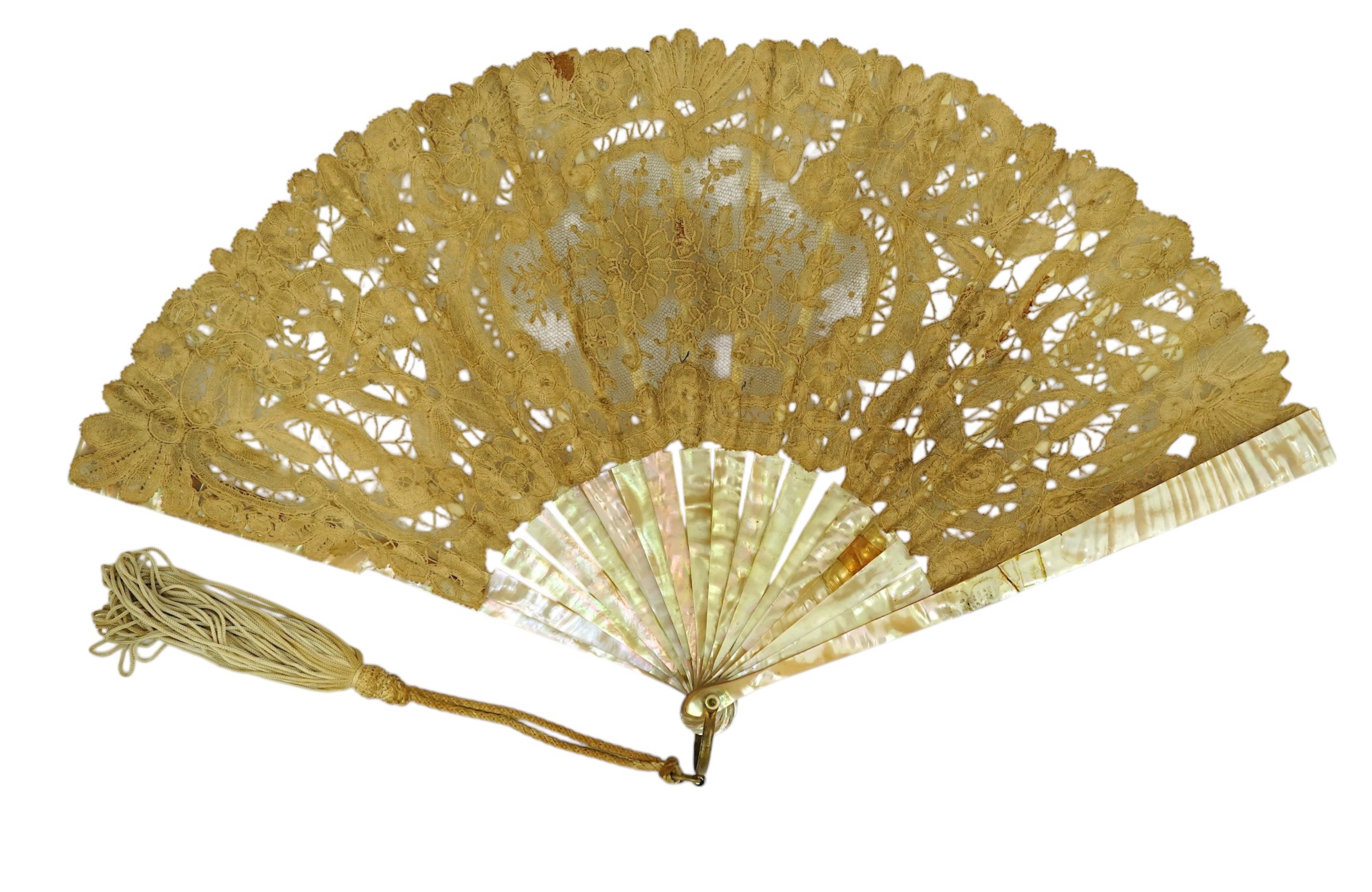 Three novelty fans with a mixed Brussels lace fan and black lace fan, a small language of love in flowers fan, a paper windmill advertising French Café fan, a carved cream Bakelite fan, a black and gilt, lace and sequin